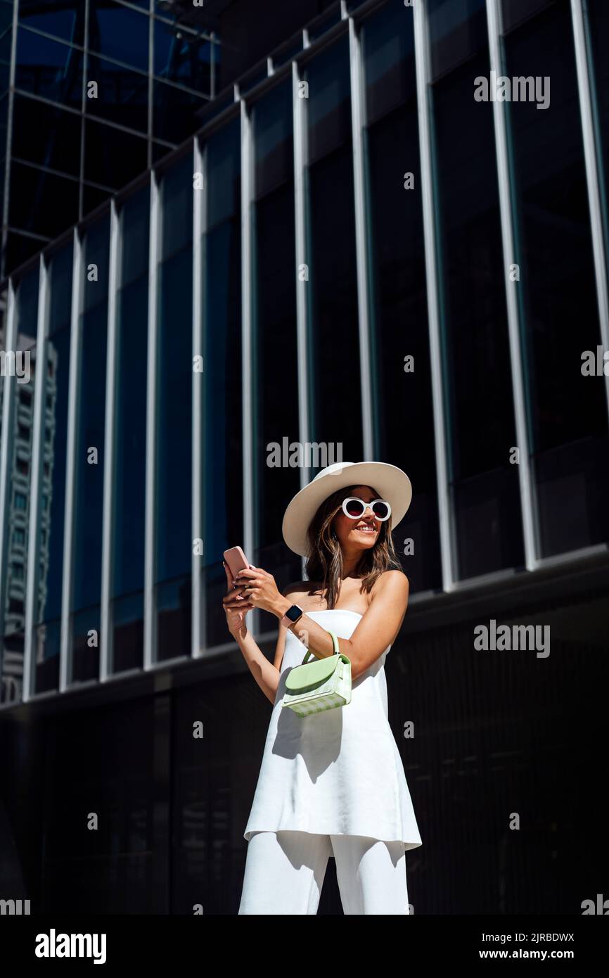 Well dressed woman standing outside hi-res stock photography and images ...