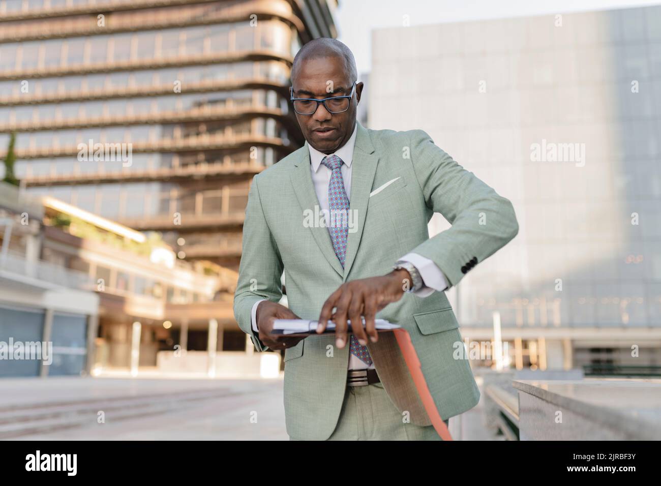 Businessman with documents at financial district Stock Photo