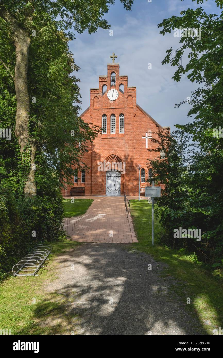 Germany, Schleswig-Holstein, Pellworm, Footpath leading to New Church of Holy Cross Stock Photo