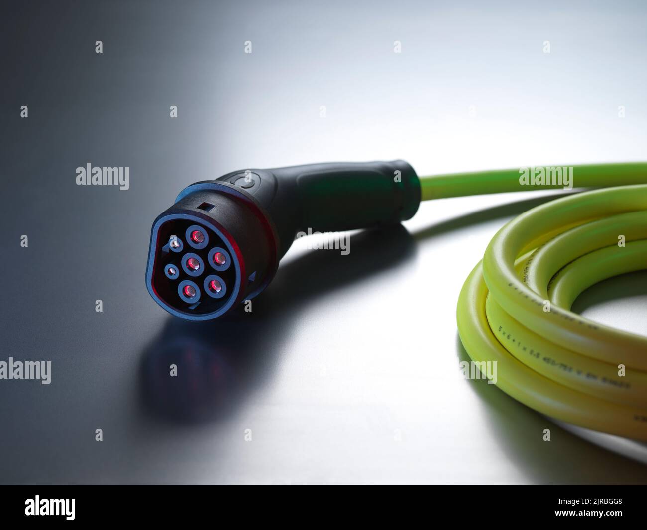 Electric vehicle charging cable on table Stock Photo Alamy