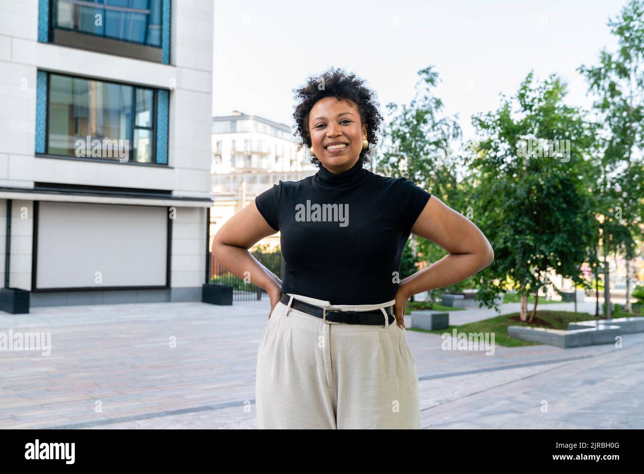 Standing with hands on hips hi-res stock photography and images - Alamy