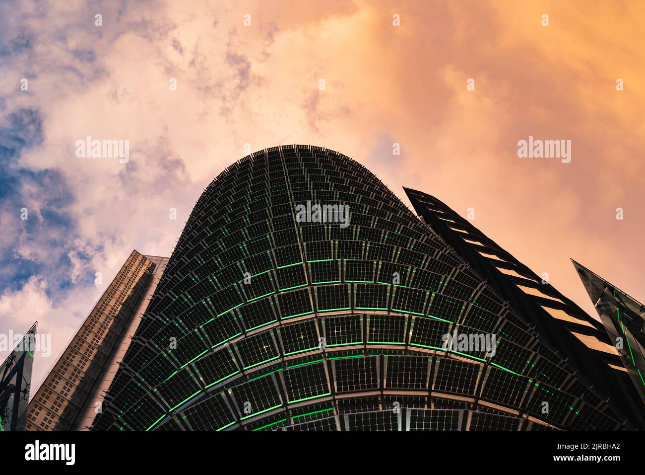 Spain, Madrid, Storm clouds over Torre Titania mall at dusk Stock Photo