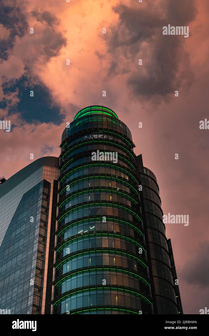 Spain, Madrid, Storm clouds over Torre Titania mall at dusk Stock Photo