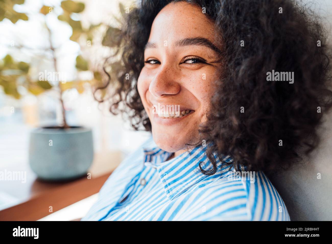 Portrait cheerful woman curly black hi-res stock photography and images ...