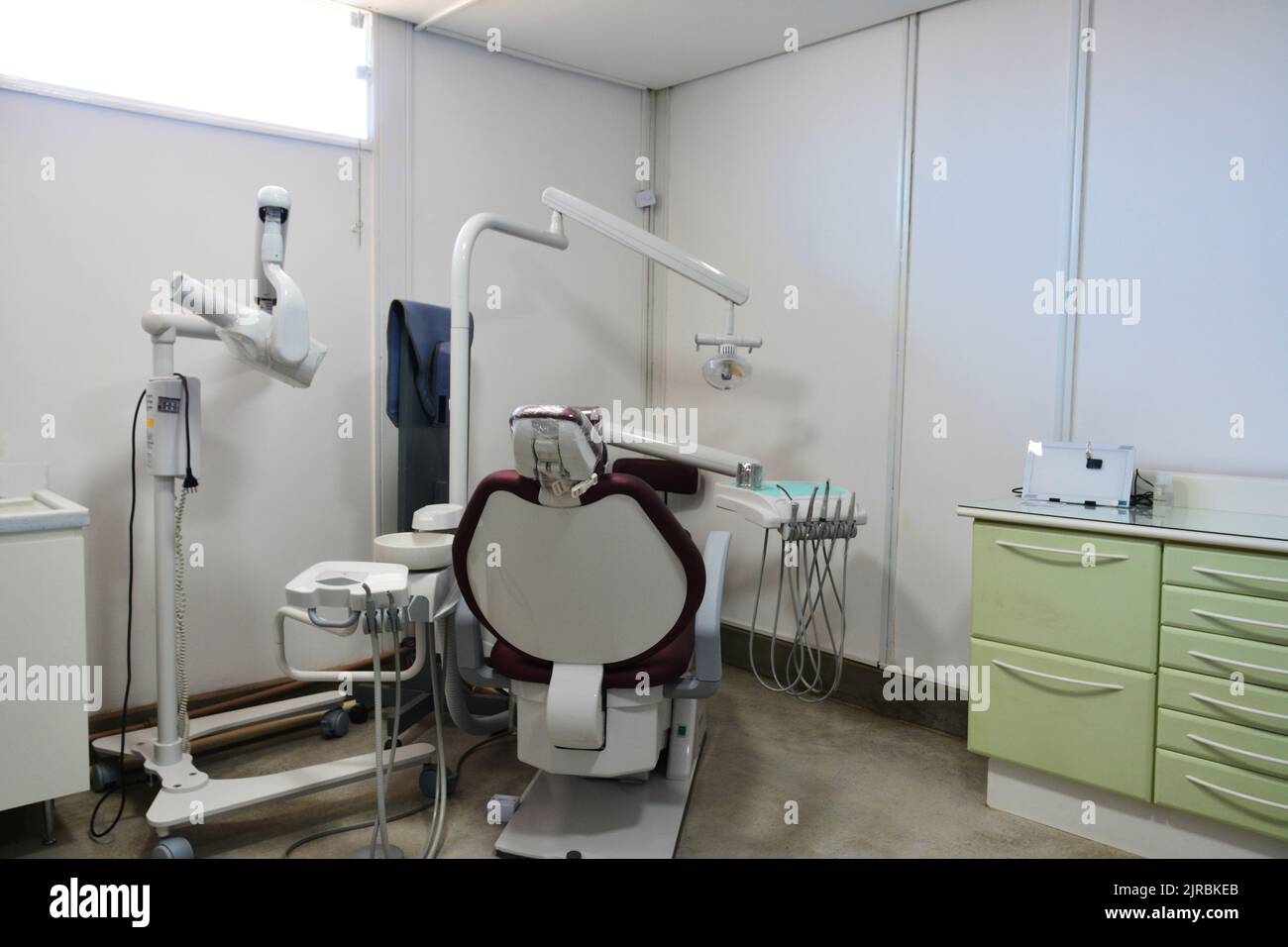 Dental office, with medical equipment, chair, cabinets, negatoscope with white walls, Brazil, South America, Latin America Stock Photo
