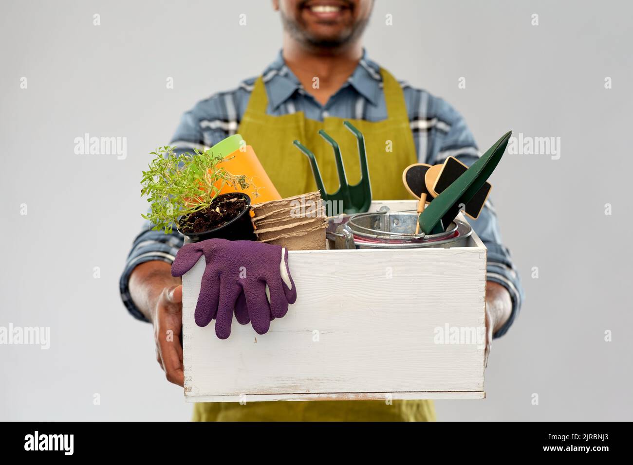 Happy male farmer holding rake hi-res stock photography and images - Alamy