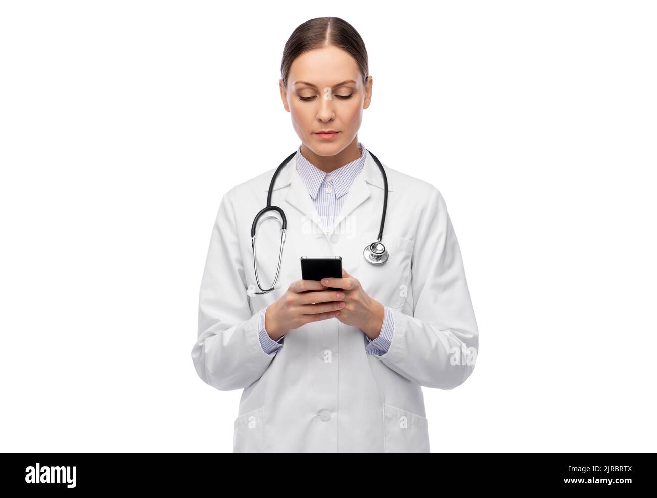 female doctor with stethoscope using smartphone Stock Photo
