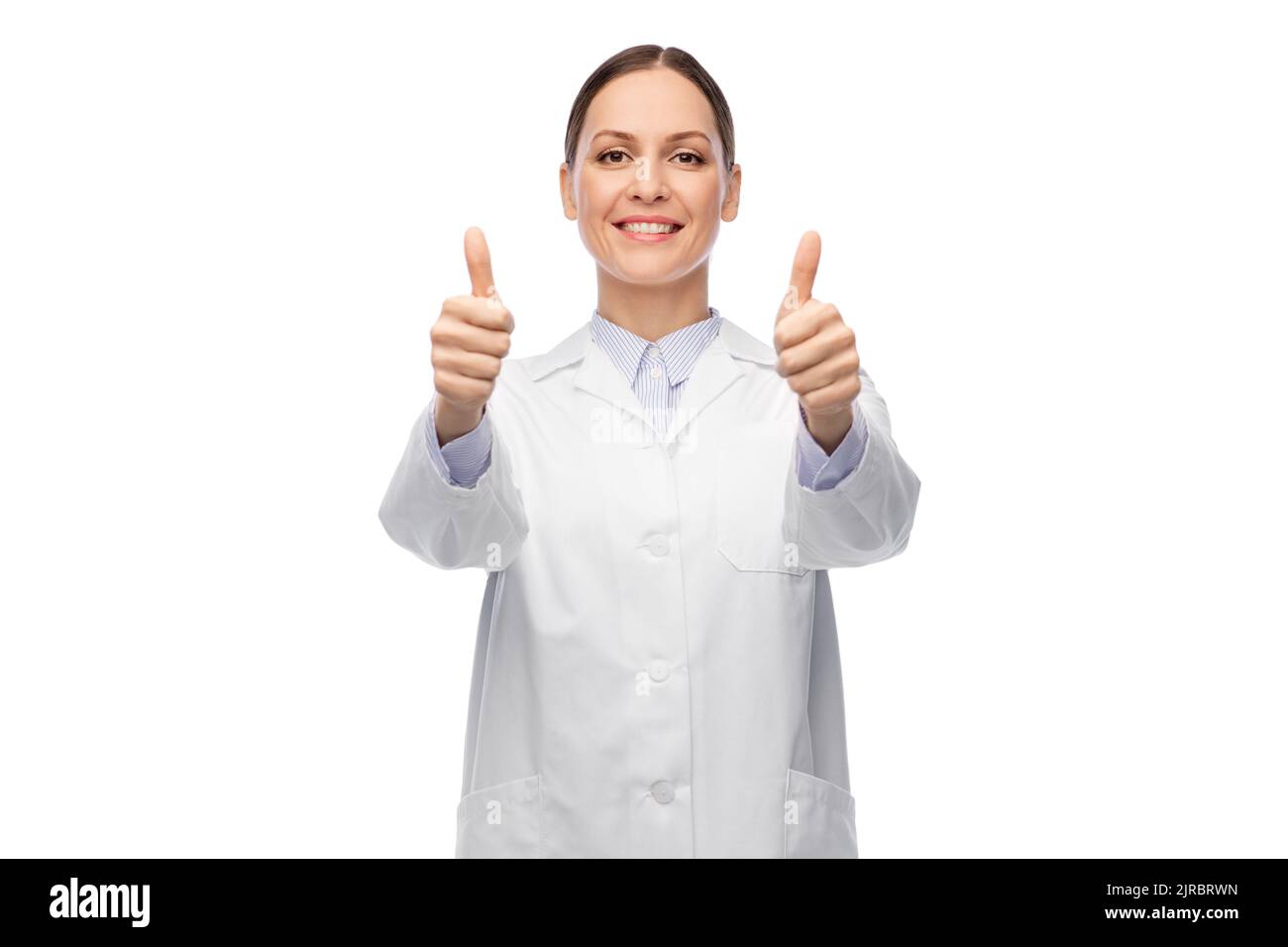 smiling female doctor showing thumbs up Stock Photo