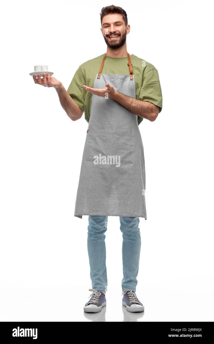happy smiling waiter in apron with cup of coffee Stock Photo