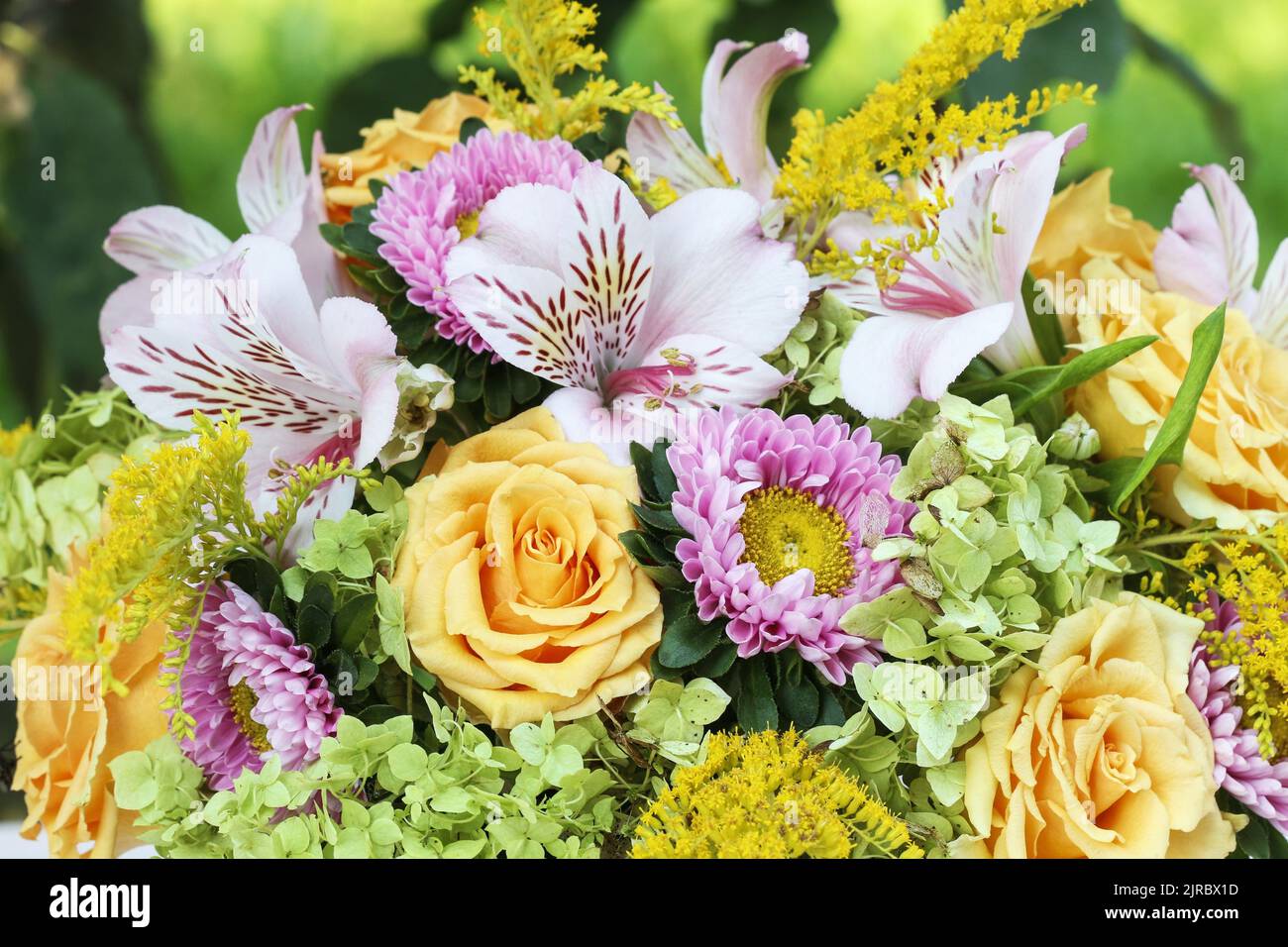 Modern table's centerpiece for summer wedding. A lot of greenery being