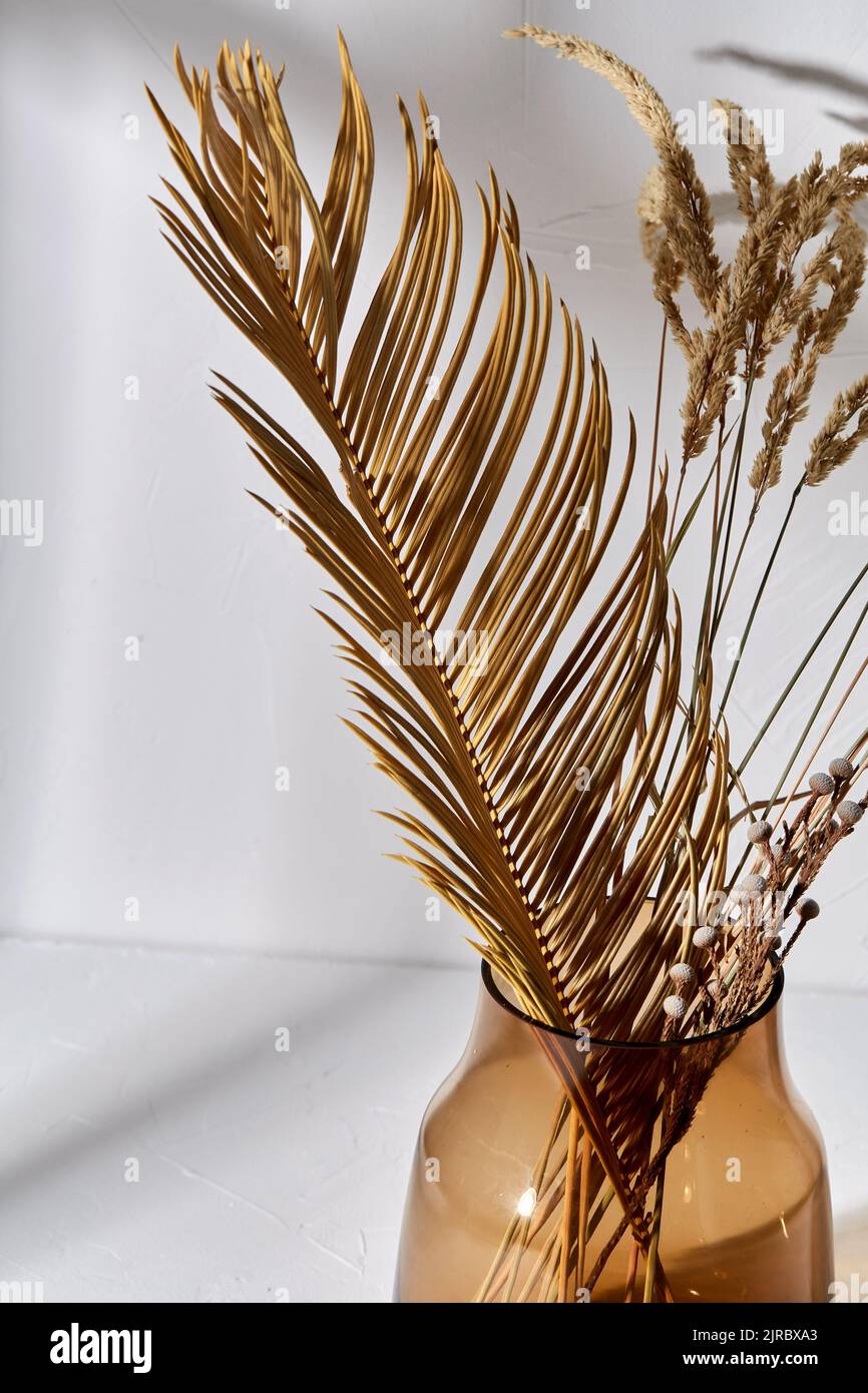 decorative dried flowers in brown glass vase Stock Photo Alamy