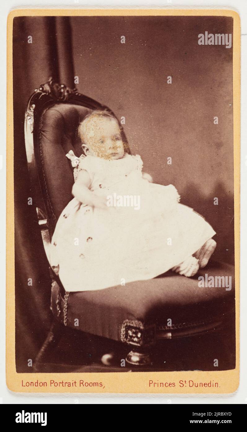 Infant on a chair, 1880s, Dunedin, by London Portrait Rooms (Dunedin). Stock Photo