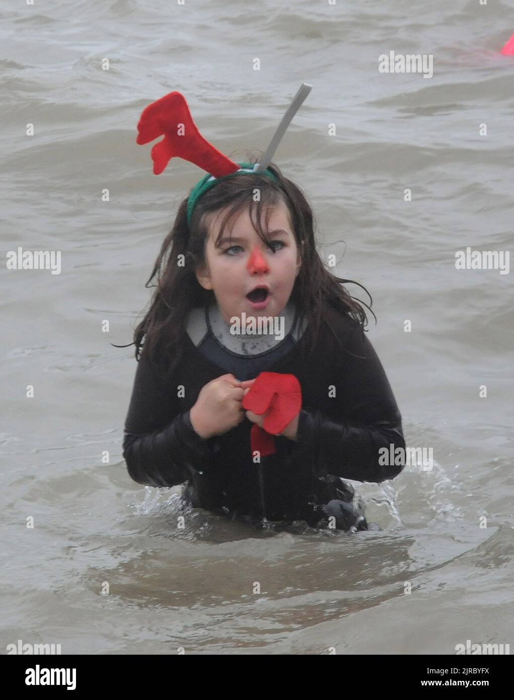 9 YEAR OLD HOLLY FAIRHALL JOINS THE GOSPORT INSHORE RESCUE NEW YEARS DIP AT STOKES BAY, GOSPORT