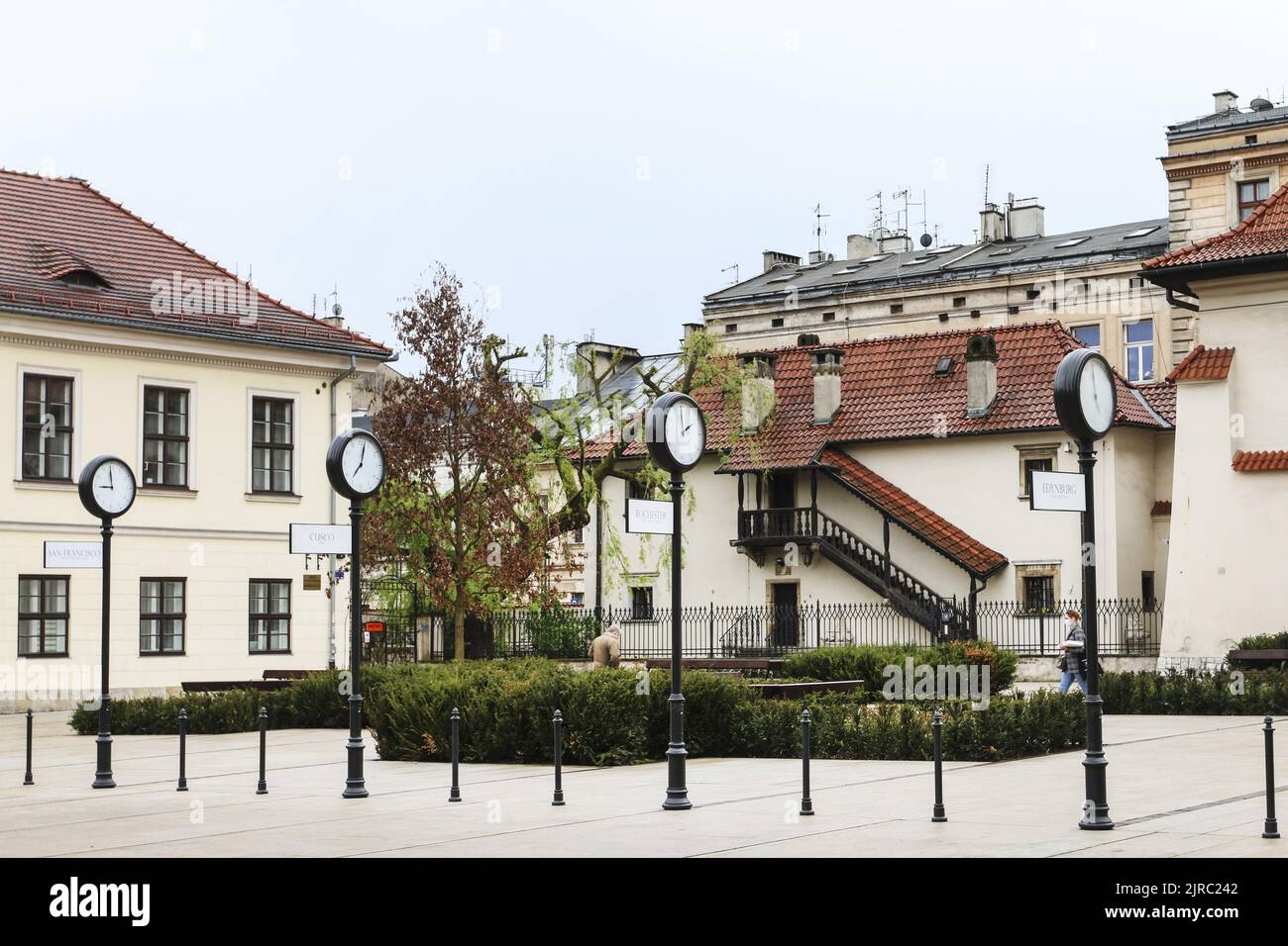 Street clocks that show the time from different time zones in Krakow, Poland Stock Photo Alamy