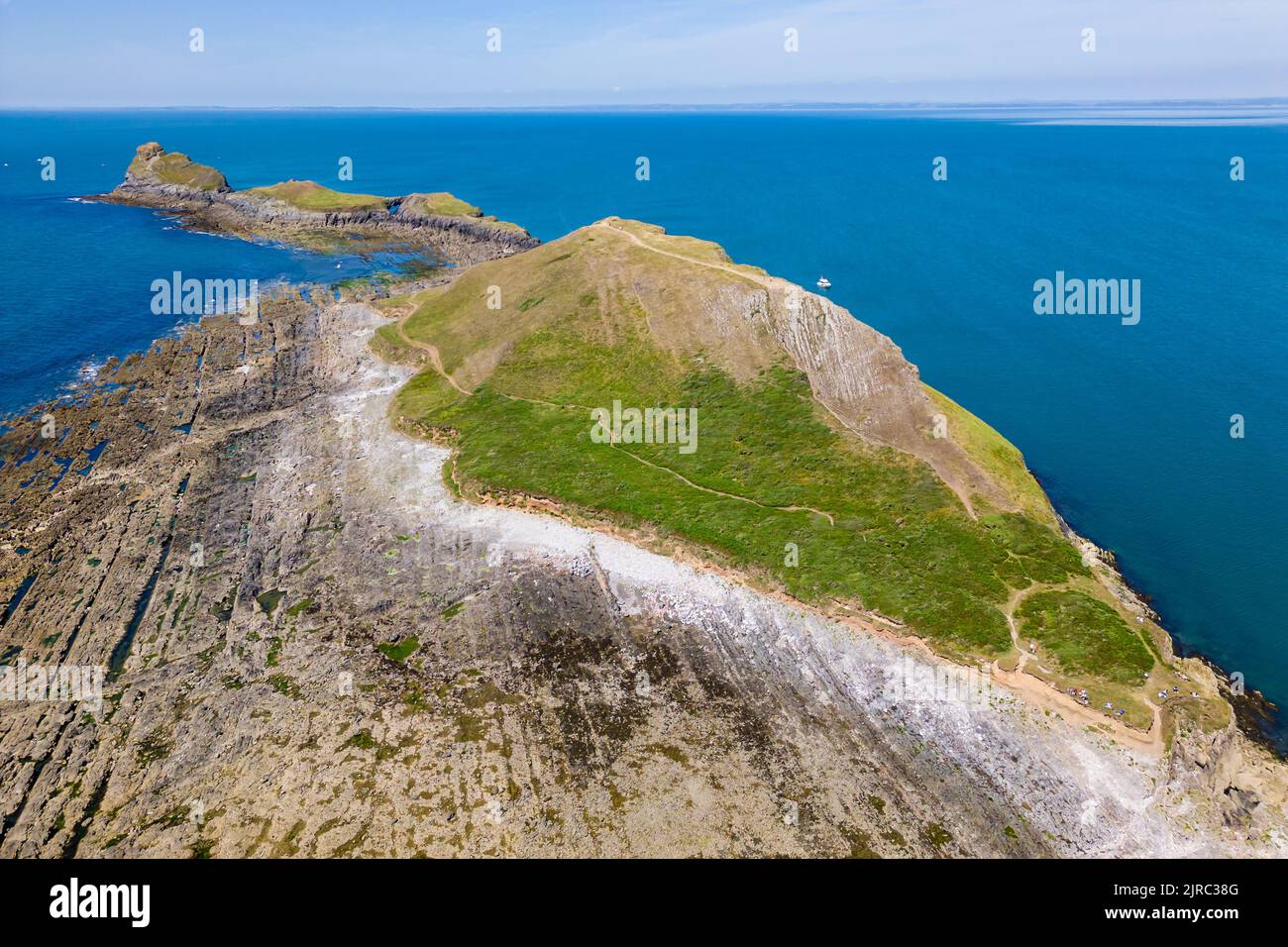 Worm's Head and the coastline of Wales at low tide (Rhossili area)es at low tide (Rhossili area) Stock Photo