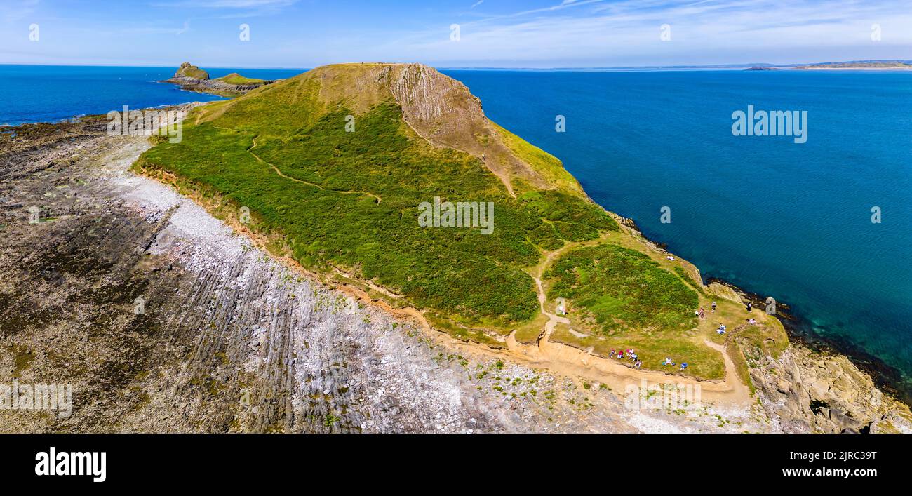 Panoramic aerial view of Worm's Head and the Welsh coastline at low tide (Rhossili, Wales) Stock Photo