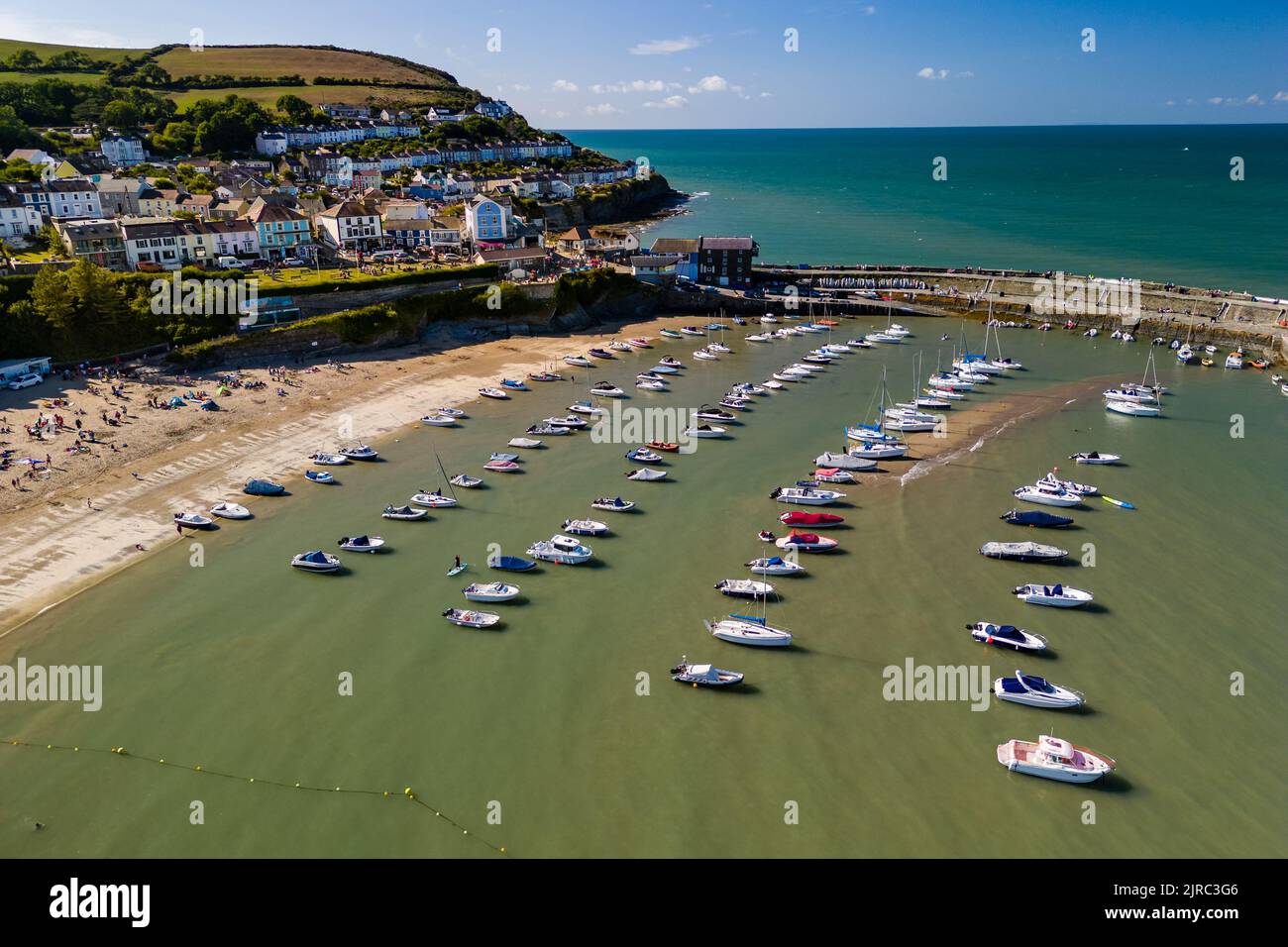 Aerial view of boats in the harbour at low tide in the Welsh seaside resort of New Quay