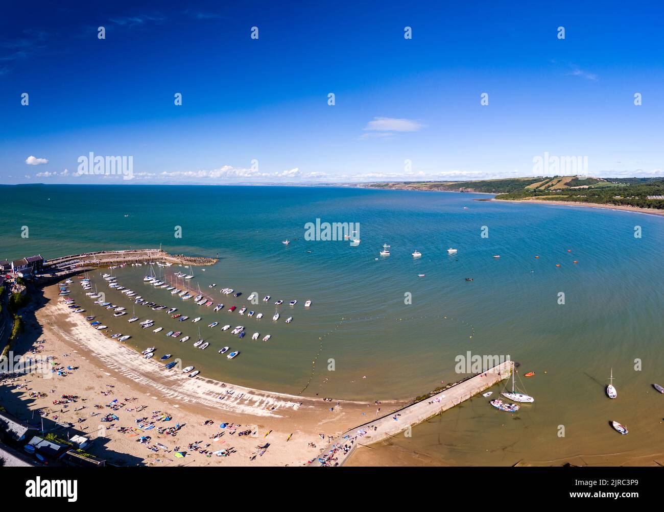 Panoramic view of the holiday resort town of New Quay on the West Wales coast in mid summer (Cardigan Bay) Stock Photo