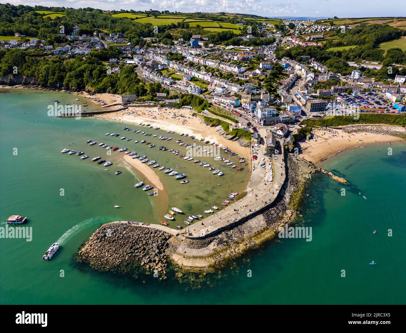 Aerial view of boats in the harbour at low tide in the Welsh seaside resort of New Quay