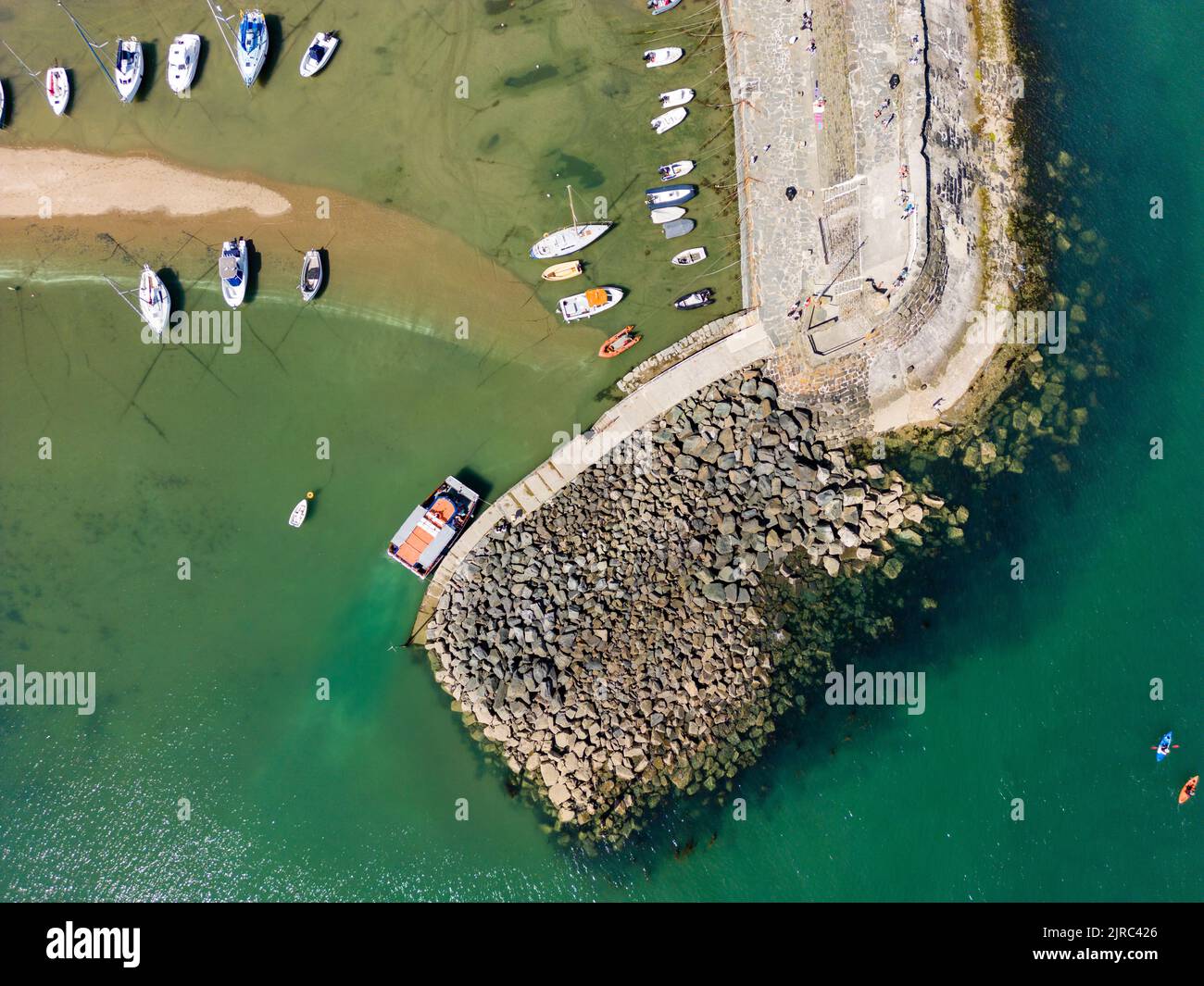 Aerial view of boats in a dry harbour at low tide (New Quay, Ceredigion, Wales) Stock Photo