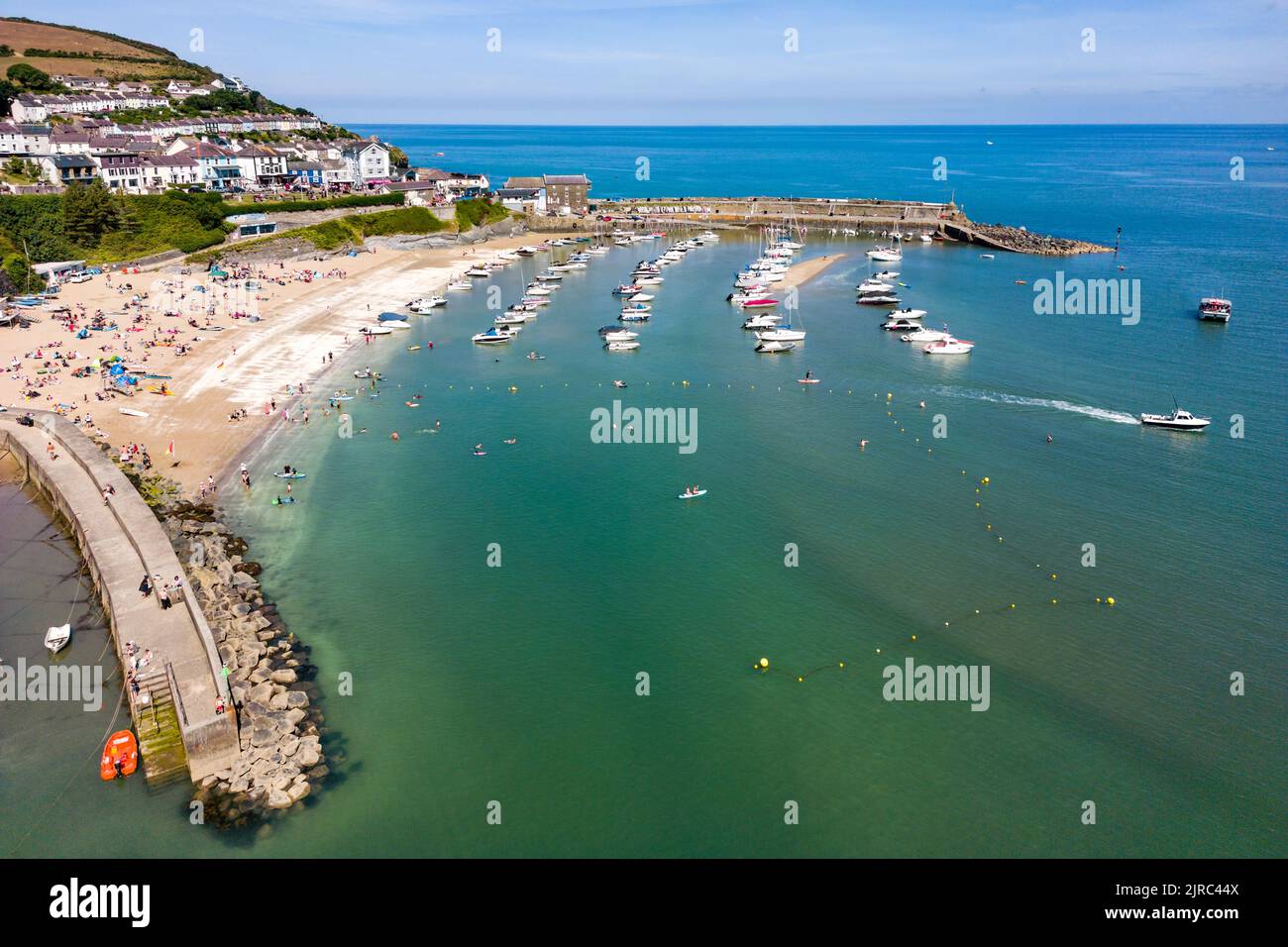 Aerial view of boats in the harbour at low tide in the Welsh seaside resort of New Quay (Ceredigion) Stock Photo
