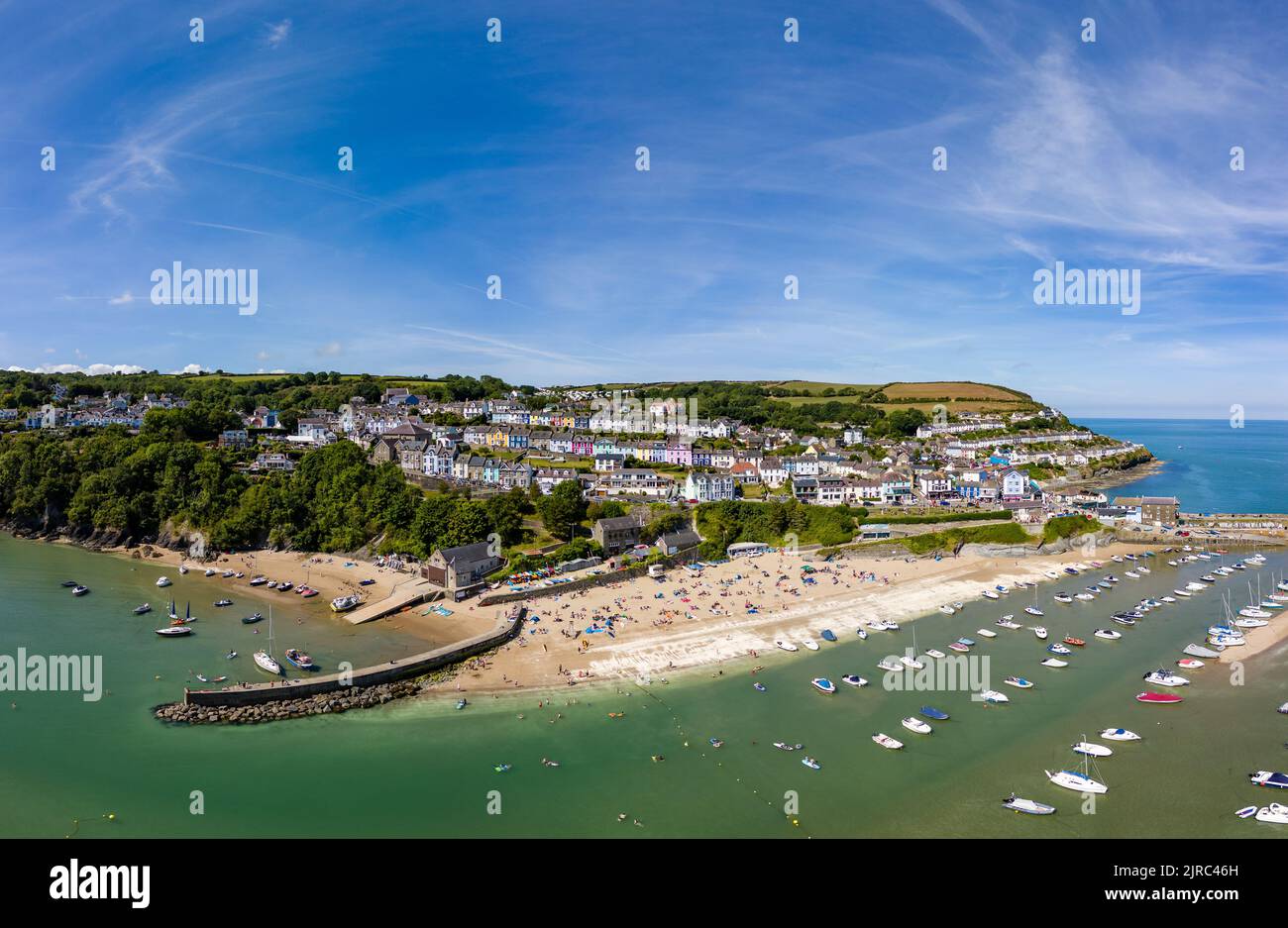 Panoramic view of the holiday resort town of New Quay on the West Wales coast in mid summer (Cardigan Bay) Stock Photo