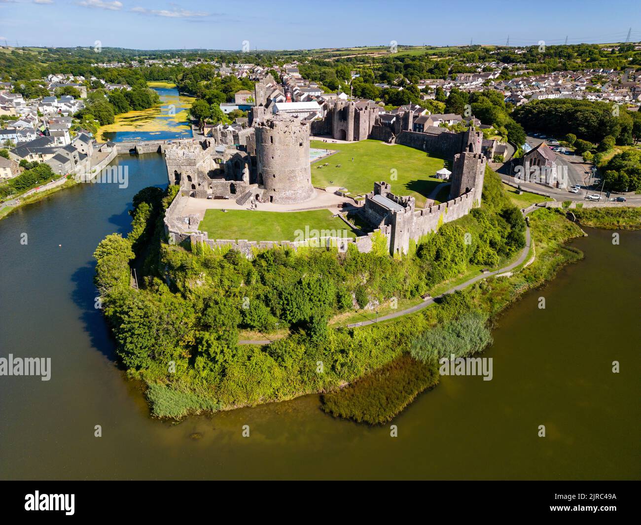 Aerial view of the ruins of a large, ancient castle in Wales (Pembroke Castle, Pembrokeshire) Stock Photo