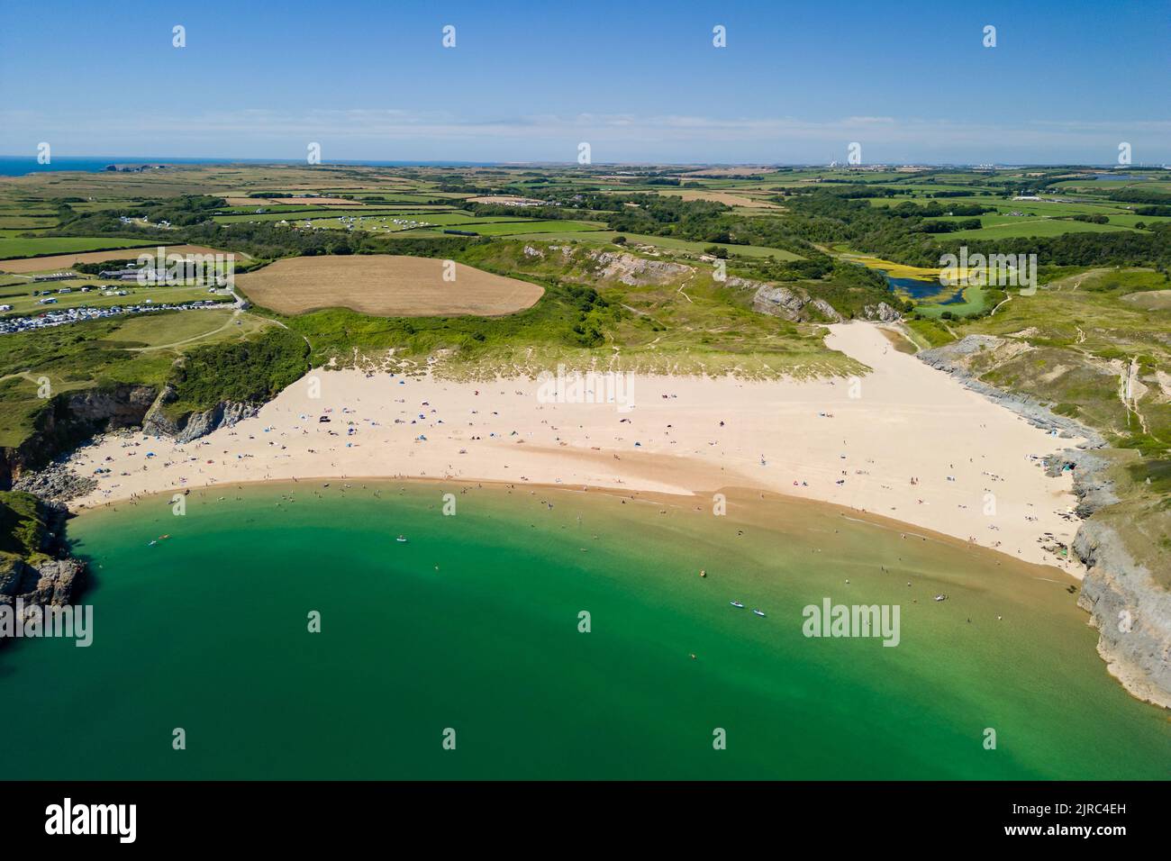 Aerial view of a huge sandy beach and clear waters (Broad Haven South, Pembrokeshire, Wales) Stock Photo
