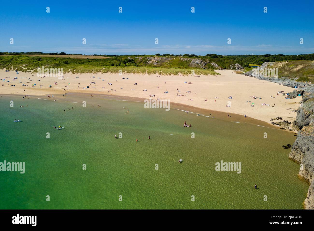 Aerial view of a huge sandy beach and clear waters (Broad Haven South