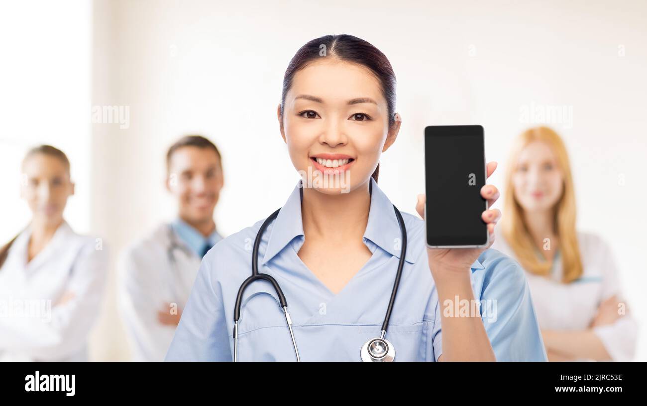 Female doctor nurse smartphone hi-res stock photography and images - Alamy