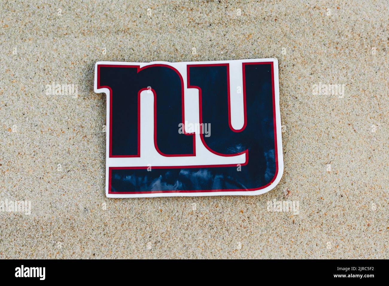 September 15, 2021, Moscow, Russia. The emblem of the New York Giants football club on the sand of the beach. Stock Photo