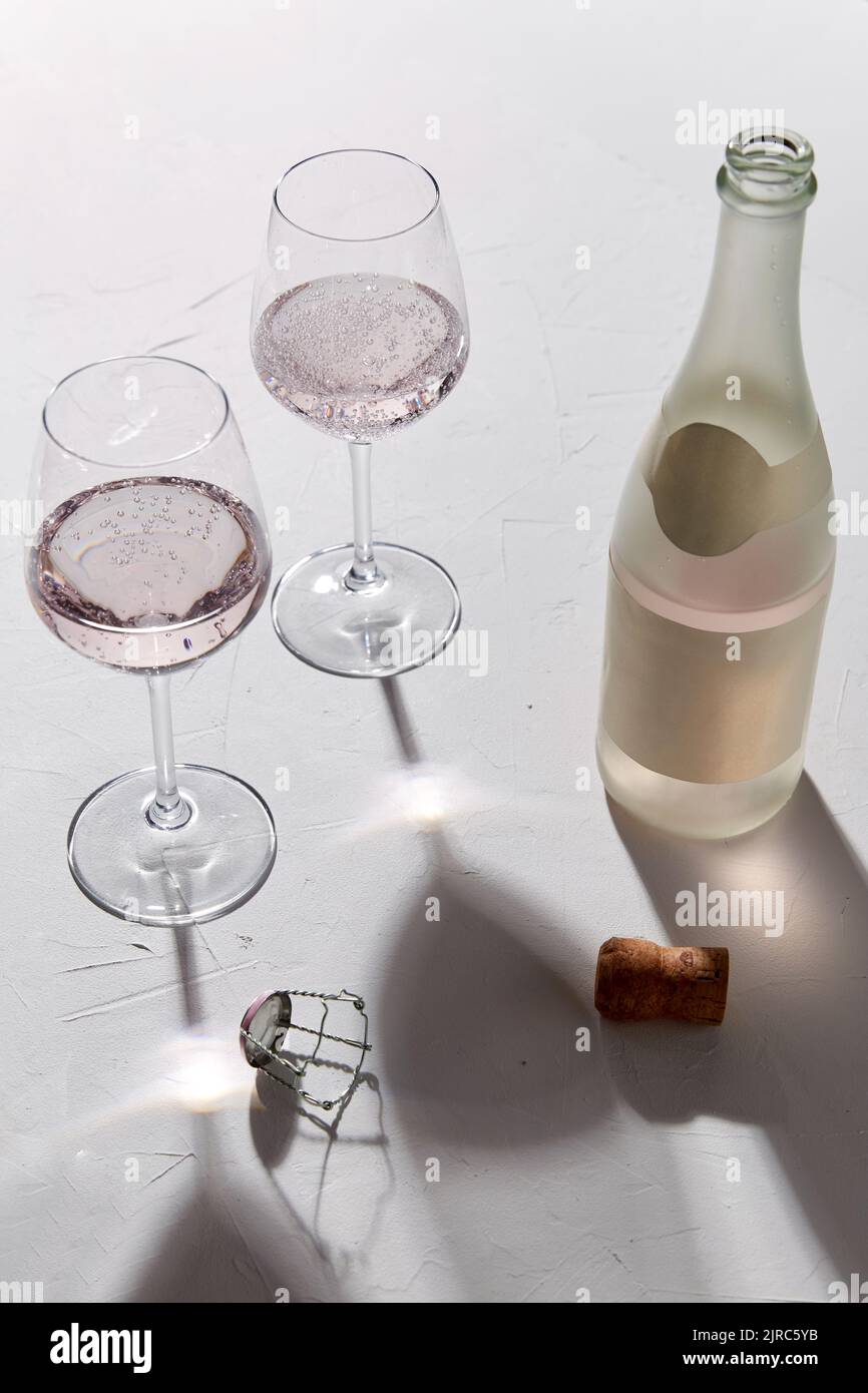 wine glasses and champagne bottle dropping shadows Stock Photo Alamy
