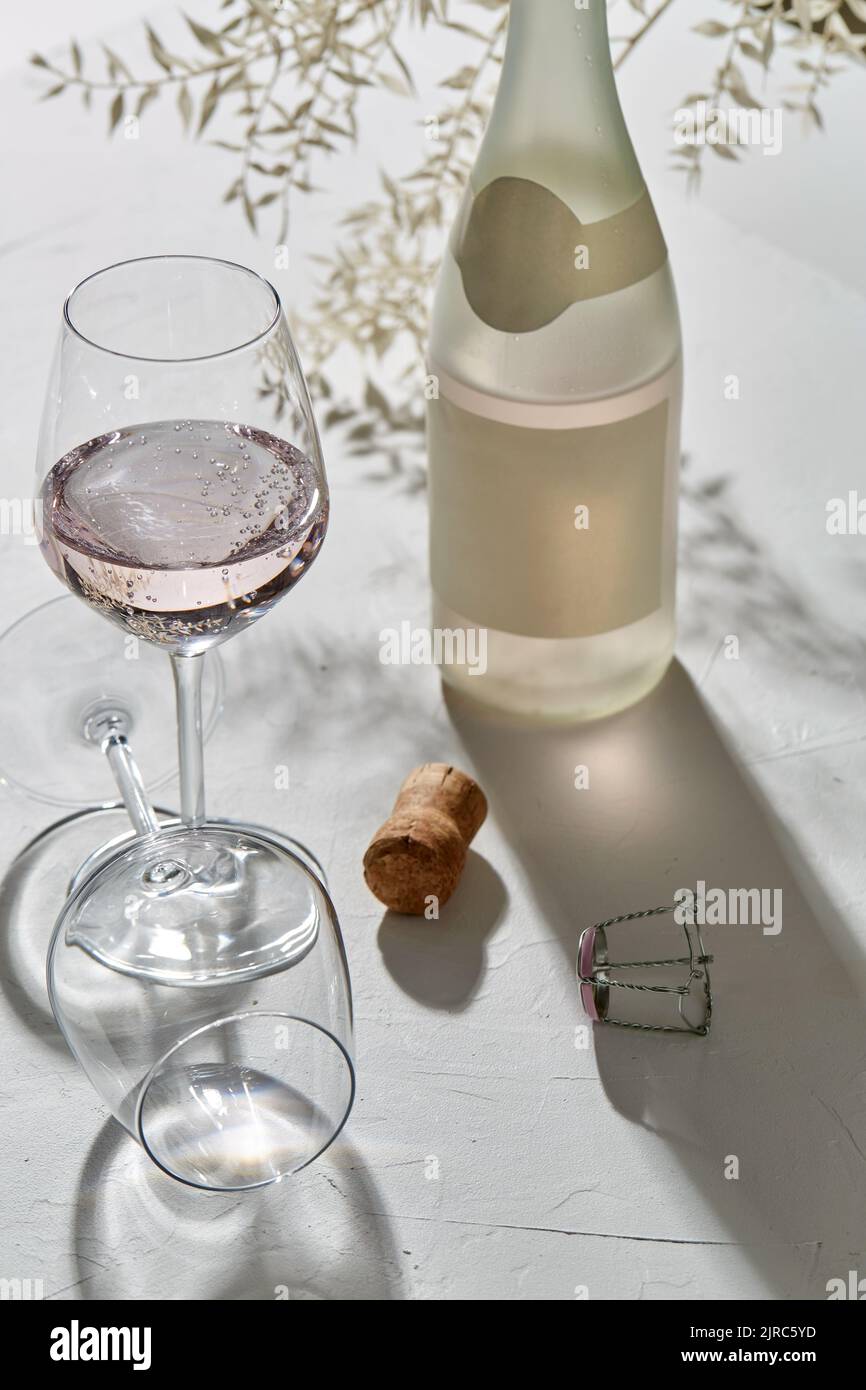 wine glasses and champagne bottle dropping shadows Stock Photo Alamy