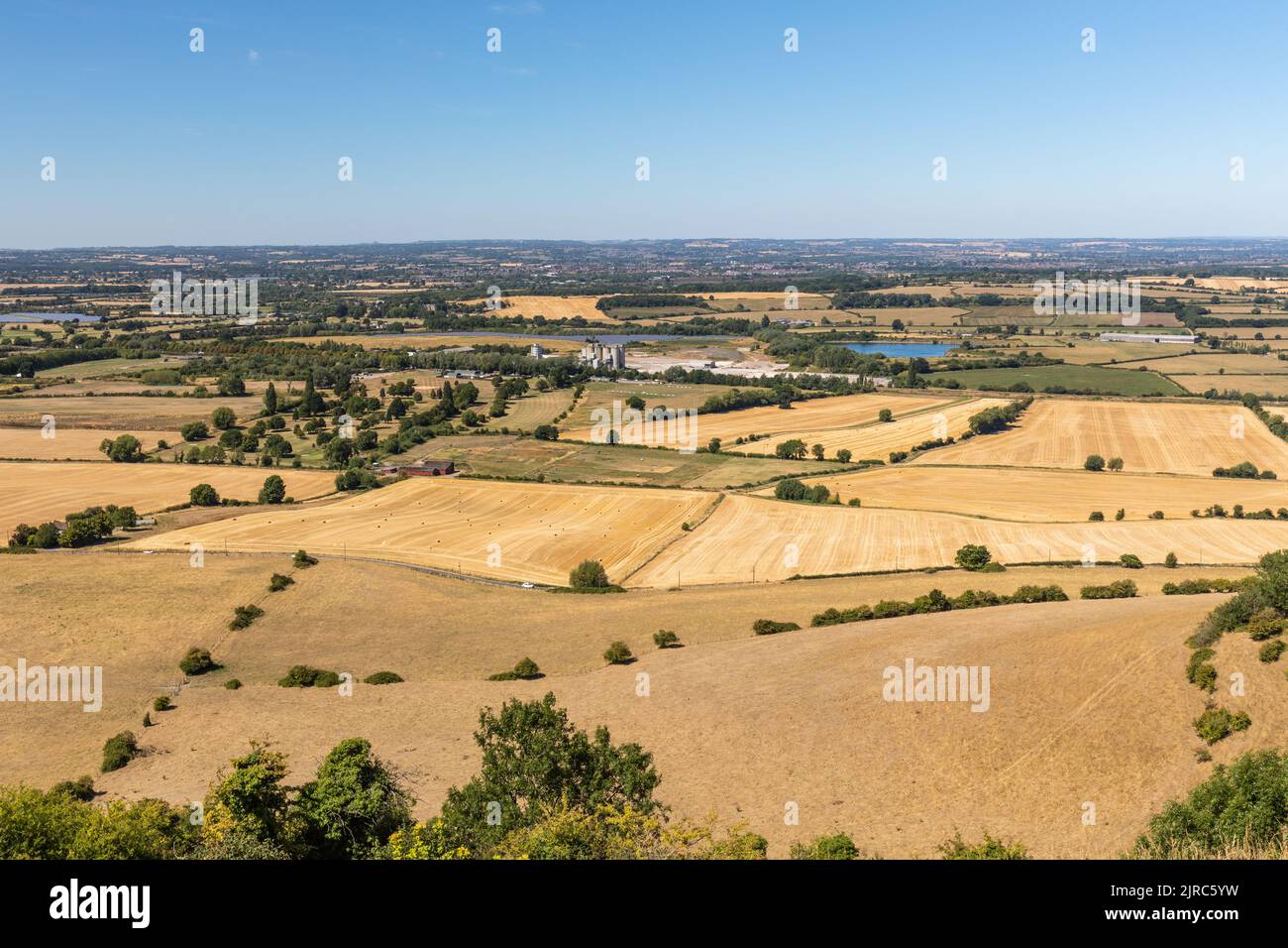 Wiltshire Countryside after prolonged dry weather during the summer heat wave from the top of Westbury White Horse,  Westbury, Wiltshire, England, UK Stock Photo