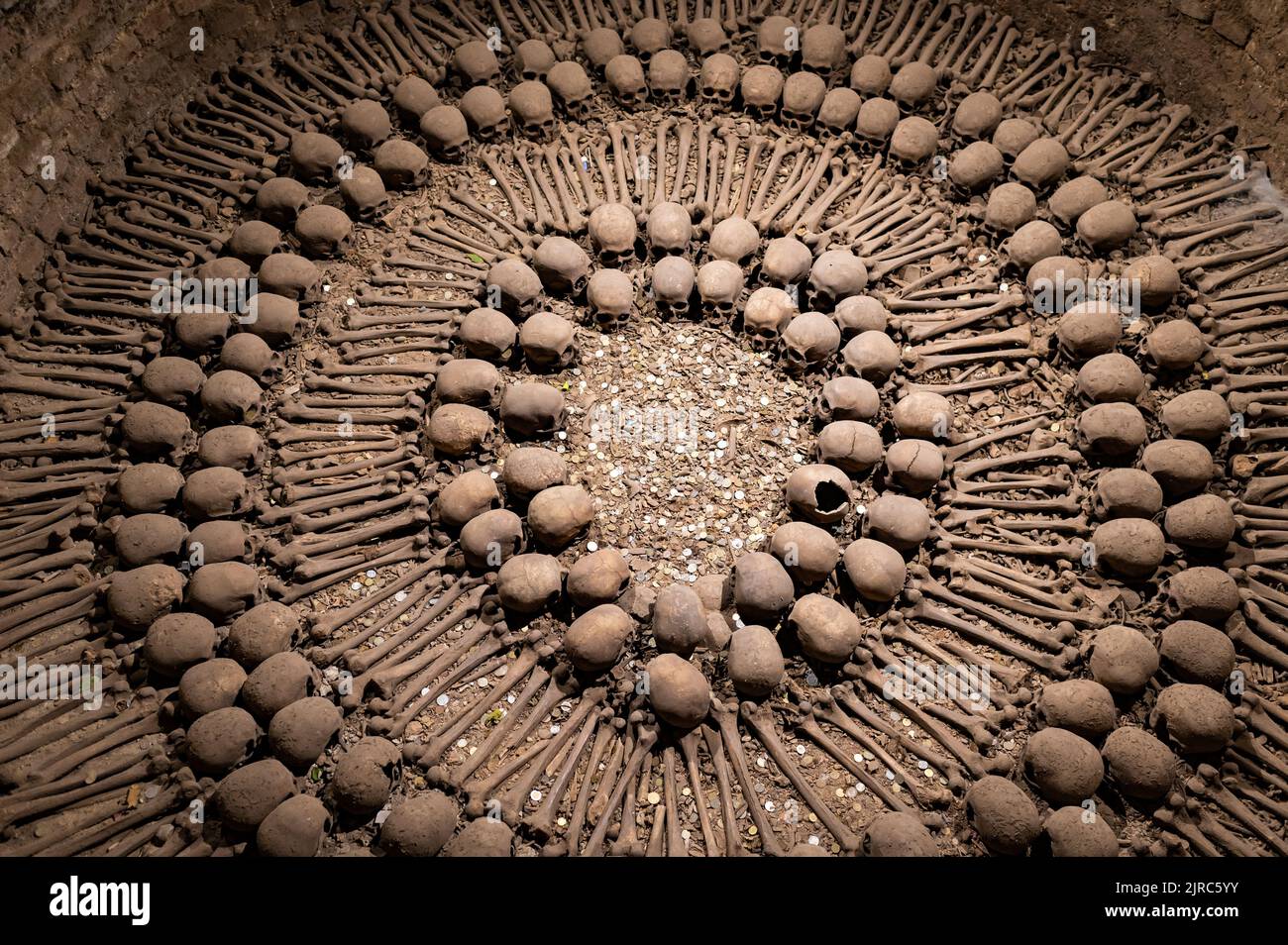 Skulls and bones arranged in Lima catacombs, Peru. Stock Photo
