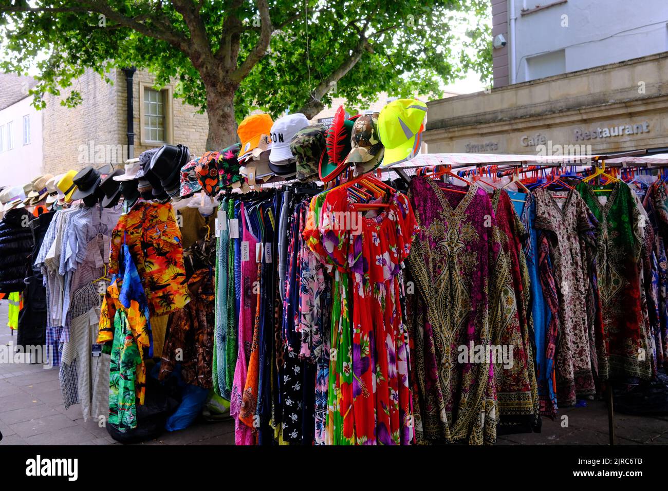 Market clothes stall, bright and colourful, Witney, Oxfordshire Stock Photo