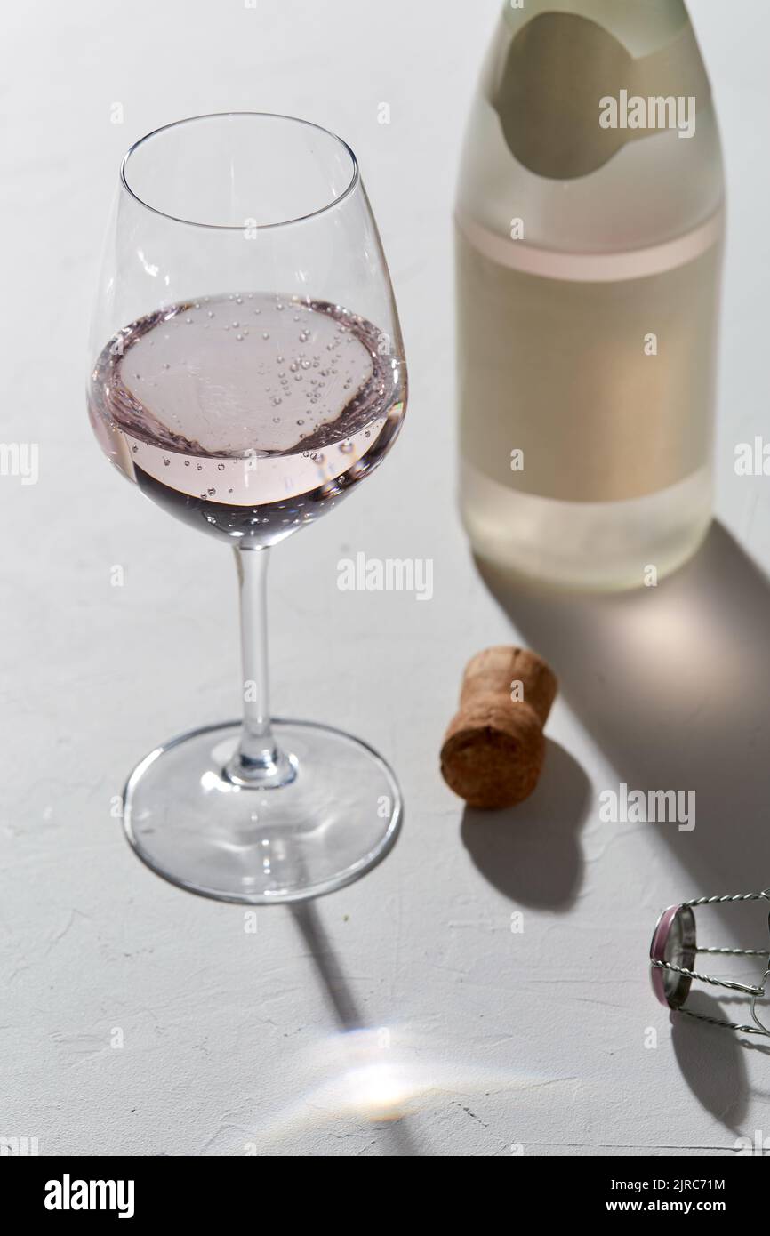 wine glasses and champagne bottle dropping shadows Stock Photo Alamy