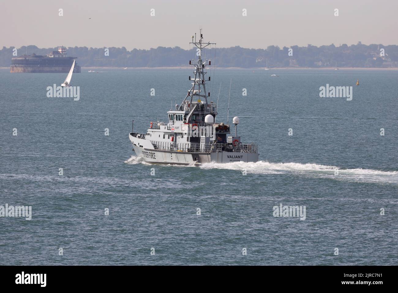 The UK Border Force cutter HMC VALIANT sails through The Solent heading for the English Channel to resume patrol duties Stock Photo