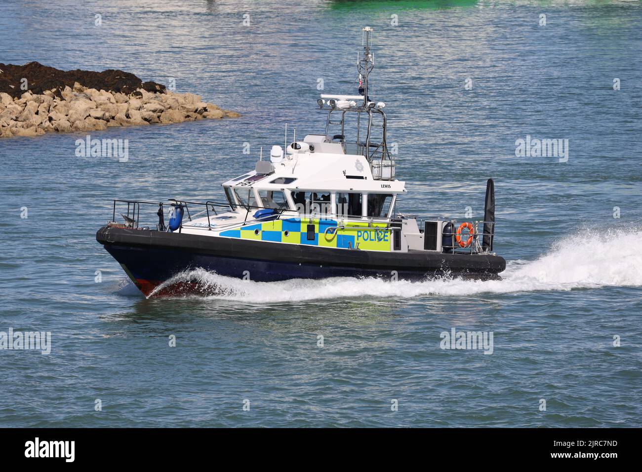 The Ministry of Defence police launch LEWIS heading towards the harbour mouth Stock Photo