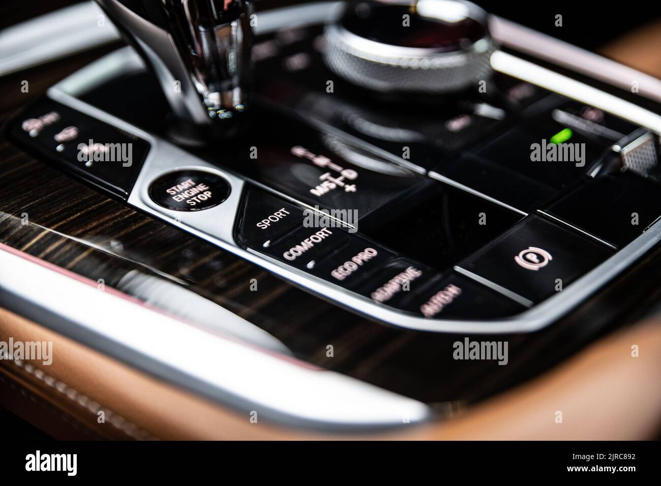 start-and-stop-button-on-the-cockpit-of-a-modern-car-next-to-the-gear