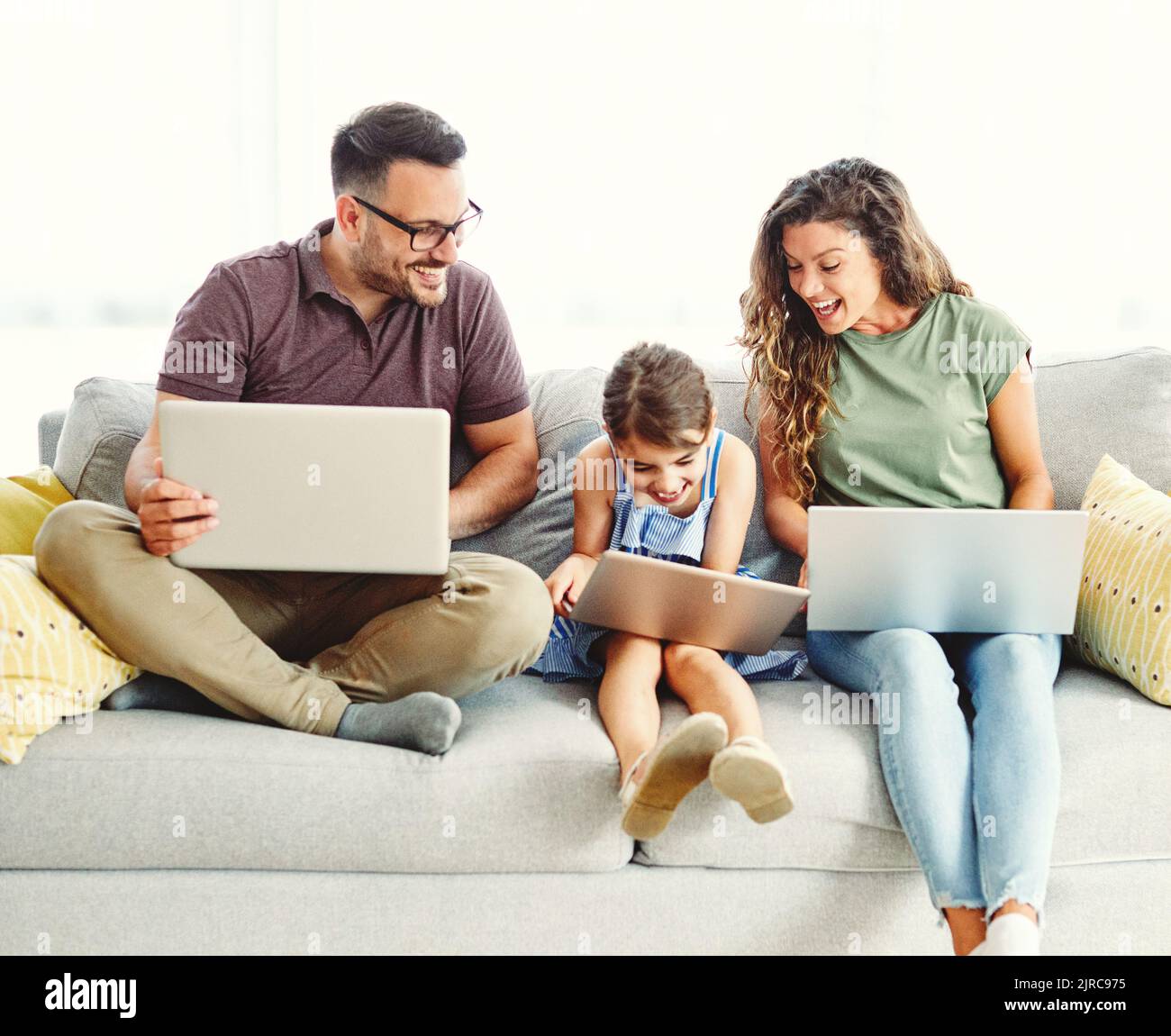 child laptop family computer woman mother father happy home man