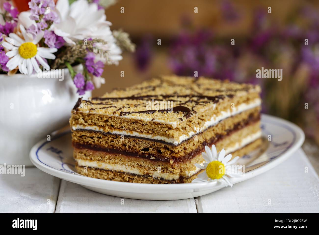 Homemade honey layer cake on the table. Party dessert Stock Photo