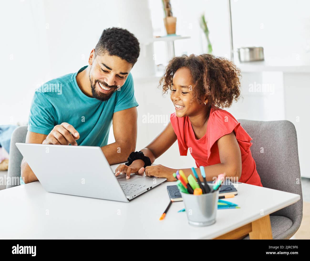 laptop computer education father children daughter girl family childhood home child parent homework task class classroom Stock Photo