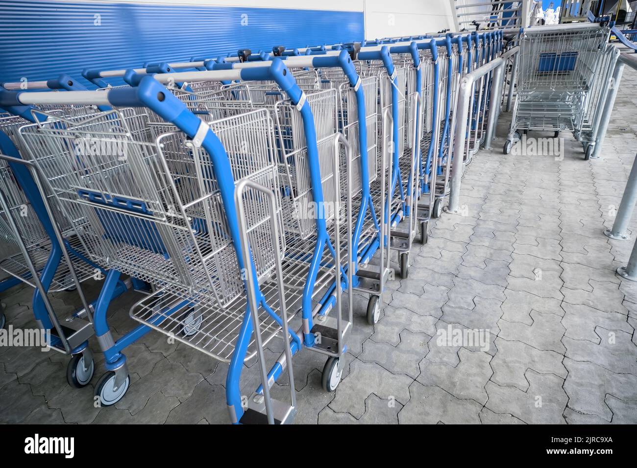 Lots of empty carts in the supermarket. The grocery store carts are ...