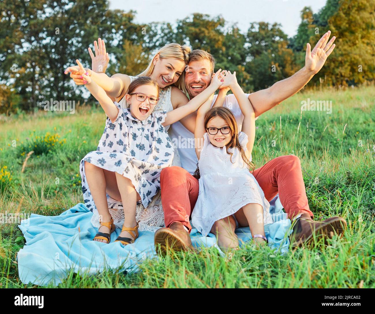 child family portrait outdoor mother woman father girl happy happiness lifestyle having fun bonding Stock Photo