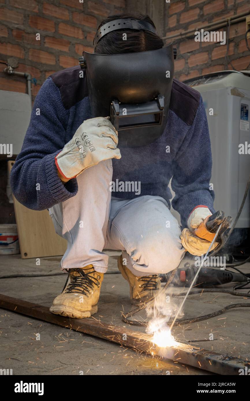 Man welding with his working tools Stock Photo