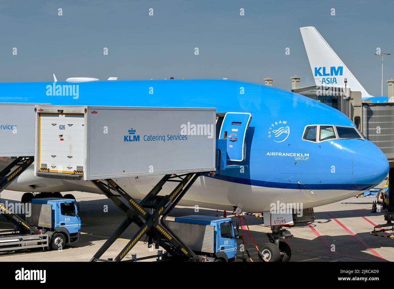 Amsterdam, Netherlands - August 2022: KLM Boeing 777 jet being loaded with catering supplies using a scissor lift truck at Schipol airport Stock Photo