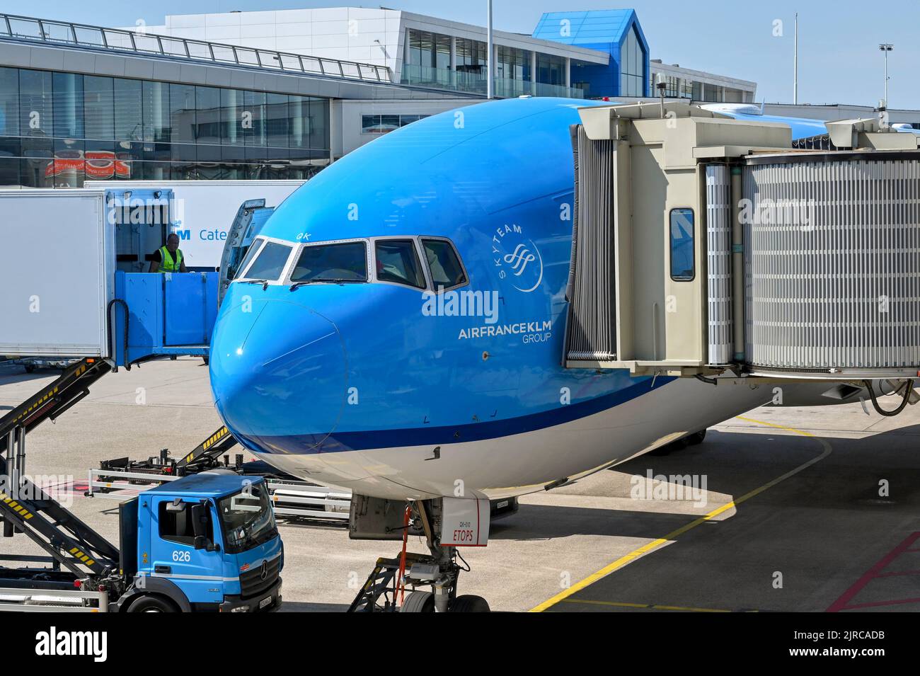 Amsterdam, Netherlands - August 2022: KLM Boeing 777 jet being loaded with catering supplies using a scissor lift truck at Schipol airport Stock Photo