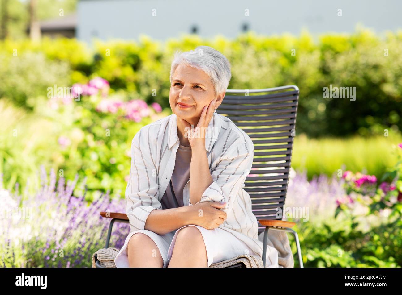 Mature woman relax summer garden hi-res stock photography and images ...