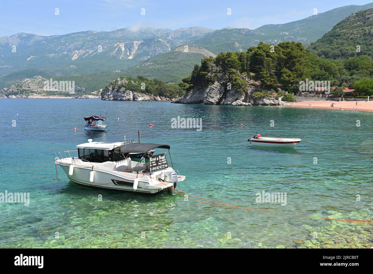 Sveti Stefan, Montenegro - June 6, 2022: Boats for rent moored in Sveti